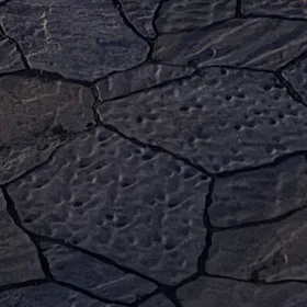 Close-up of flagstone-pattern pavers at dusk